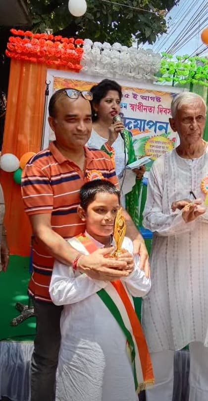 Another young prize-winner with family and club elders