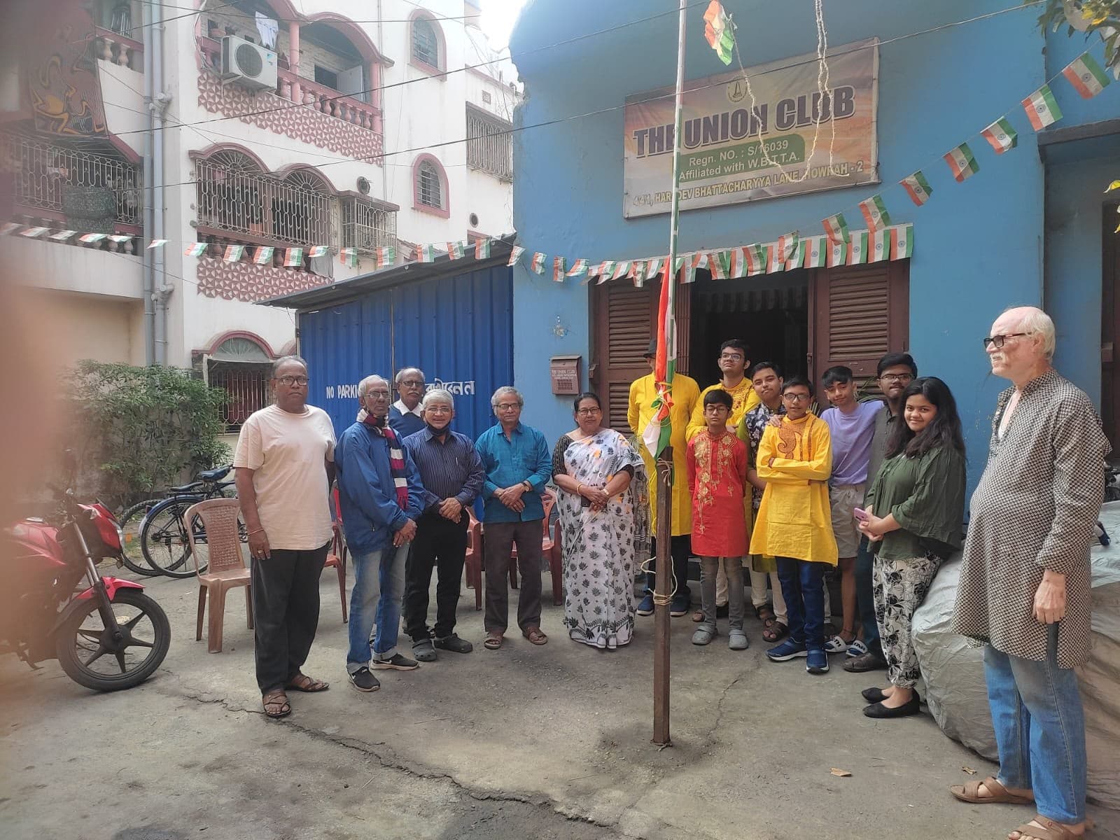 Members, elders and young people outside the club